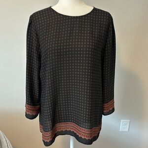 Tunic blouse with 3/4 length sleeves. Black, gold, red, and burgundy colors.
